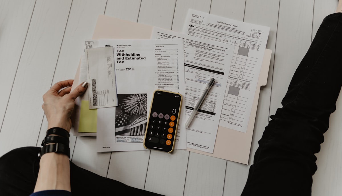 Calculator and financial documents for pricing a YouTube sponsorship deal